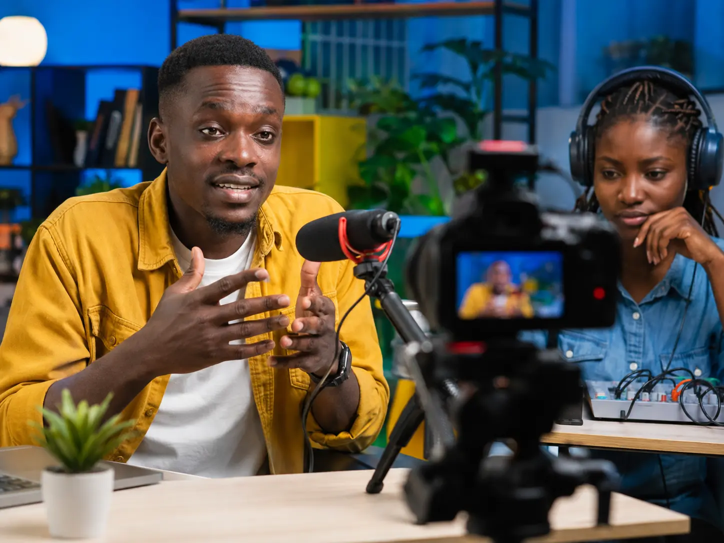 African content creators recording an educational video in a professional studio